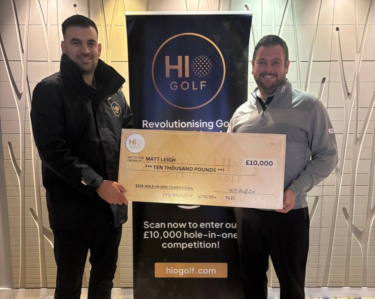 Golfer celebrating hole-in-one win with £10,000 prize at HiO Golf competition