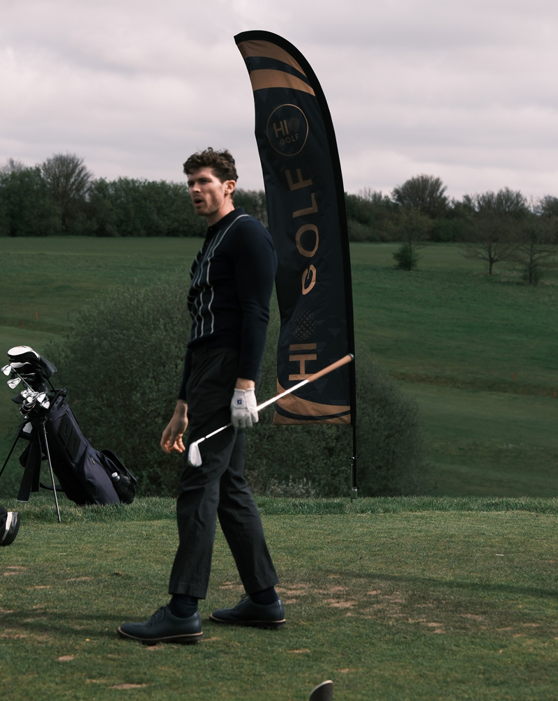 Golfer playing hole-in-one competition at UK golf course with HiO Golf