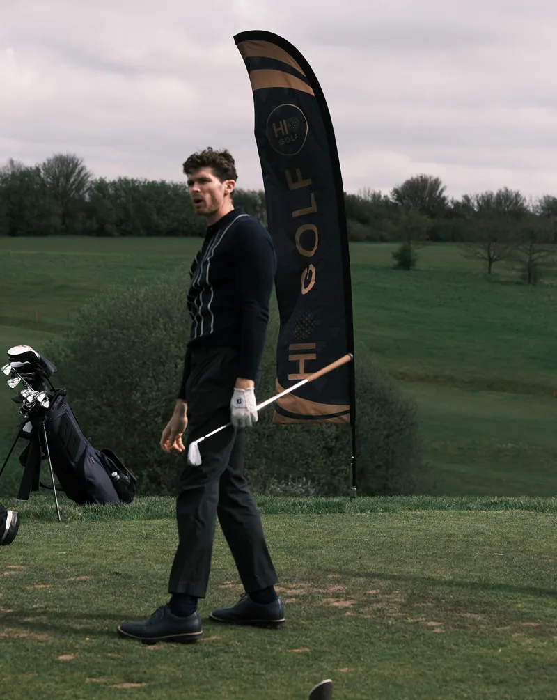 Golfer playing hole-in-one competition at UK golf course with HiO Golf